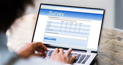 Image of a person taking a survey on a computer