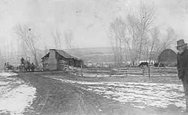 Pioneer cabin of John W. McBroom on Bear Creek, 1887; McBroom on the right.