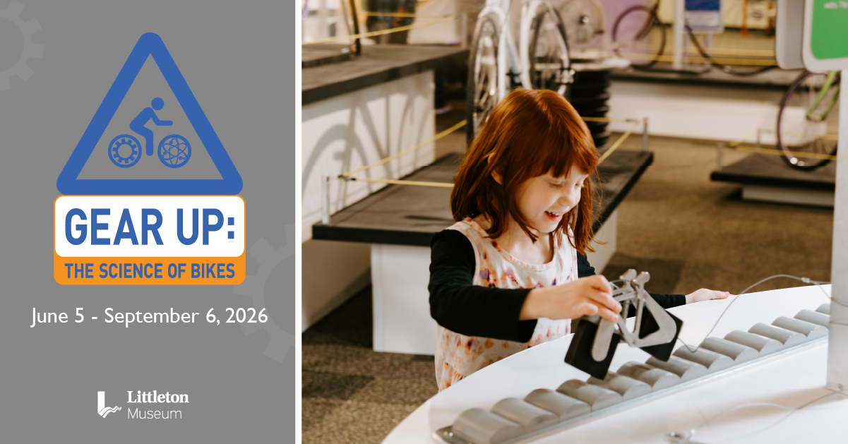 Photo of a red-headed child playing with a toy bicycle with square wheels