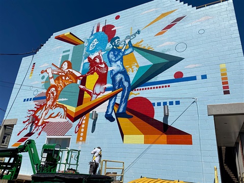 Artist Michael Ortiz paints mural on Town Hall, 2023