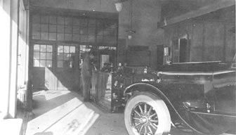Interior of I.W. Hunt Ford Agency at 2309 W. Main Street, c.1928. Automobile is one of the first Lincolns manufactured. Photo by Edwin Balmer.