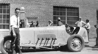 Joe Unser stands next to the car he drove in the Pike's Peak Race 1929.jpeg