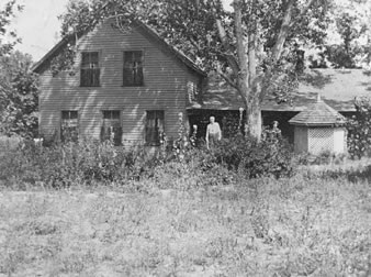 Col. and Mrs. Robert J. Spotswood in front of their ranch home west of Littleton, on the site of the present Columbine Country Club. Photo taken about 1895.