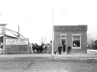 Littleton Lumber Co. office at the northwest corner of Main and Prince Streets. Built in 1901, this photo was taken four years later. Joe Wise is pictured sitting on the wagon, Manager Harry Nutting on left, Ed Sterne in doorway, Rupert E. Skip Nutting on right.